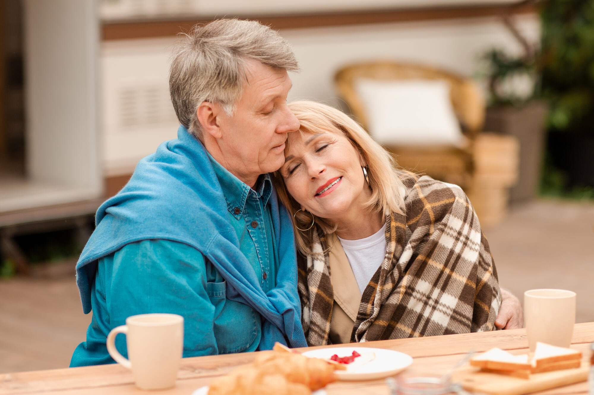 Senior-man-cuddling-with-his-w